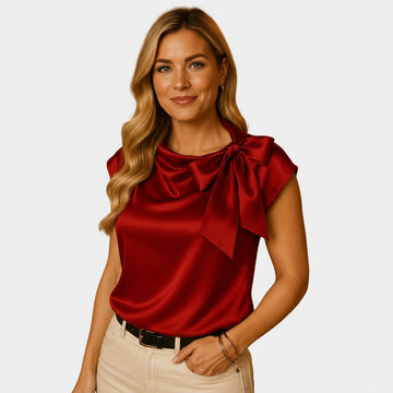Women’s sleeveless satin blouse with large bow